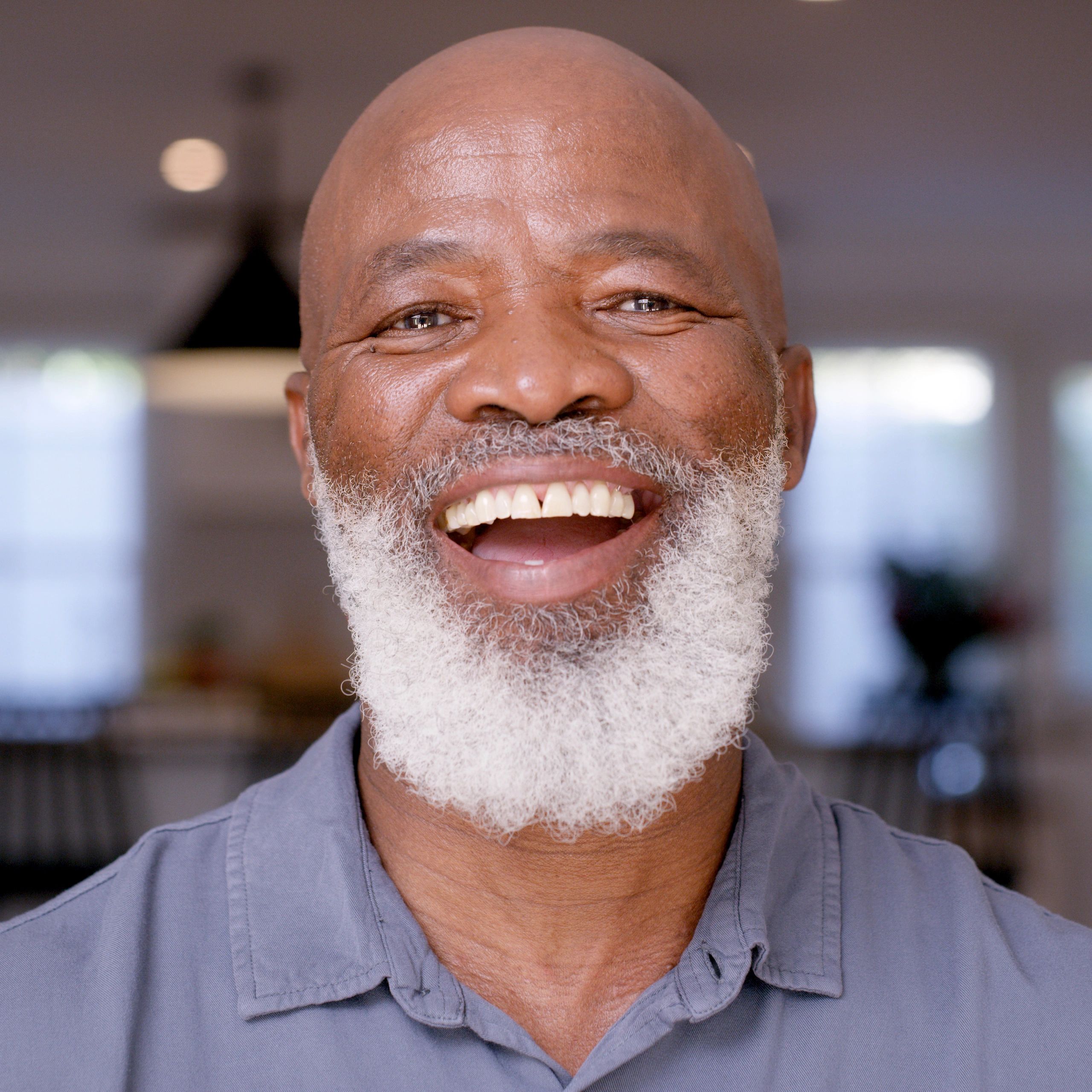 Portrait of a happy homeowner smiling indoors